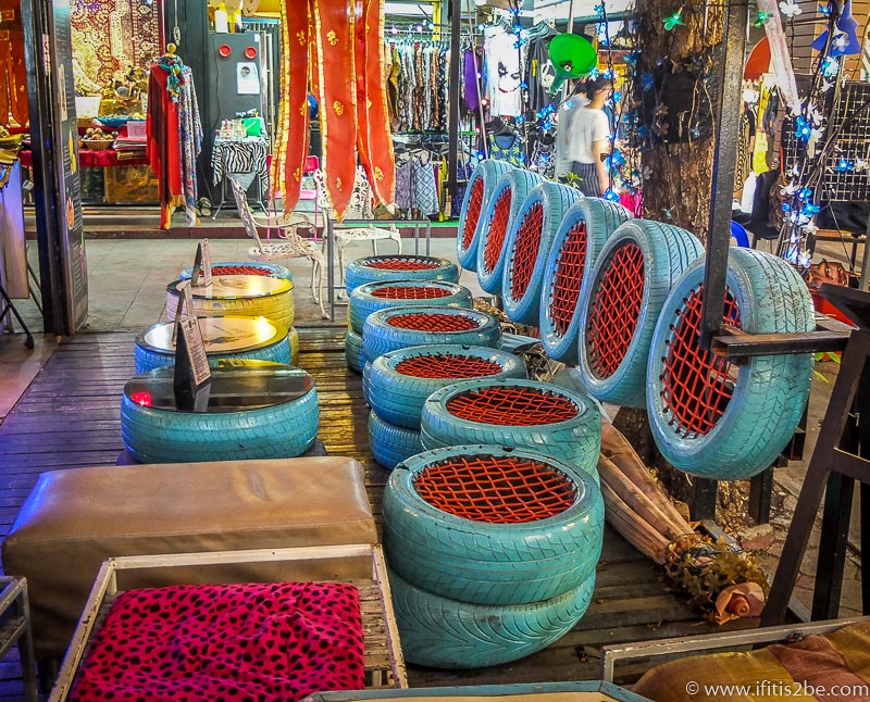 Cool chairs made from car wheels in a small bar inside the indoor night market in Chiang Mai